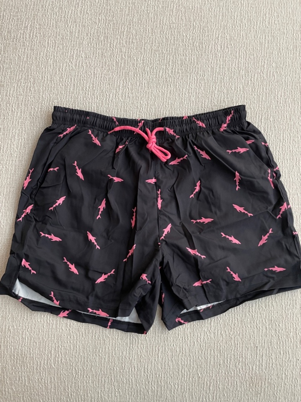 Men’s Black Swim Shorts with Pink Shark Print, with compression shorts under.